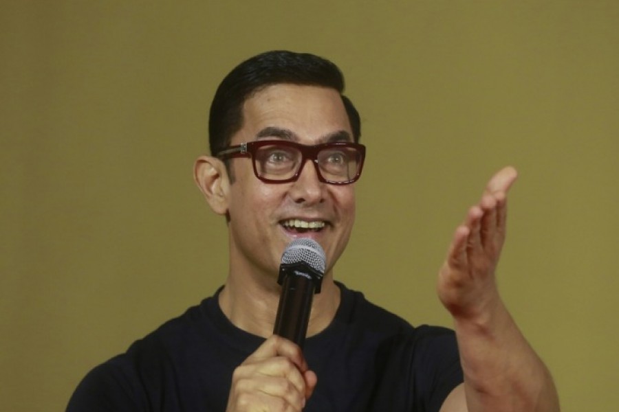 Bollywood actor Aamir Khan speaks to the media in Mumbai, India [File: Rafiq Maqbool/AP Photo]