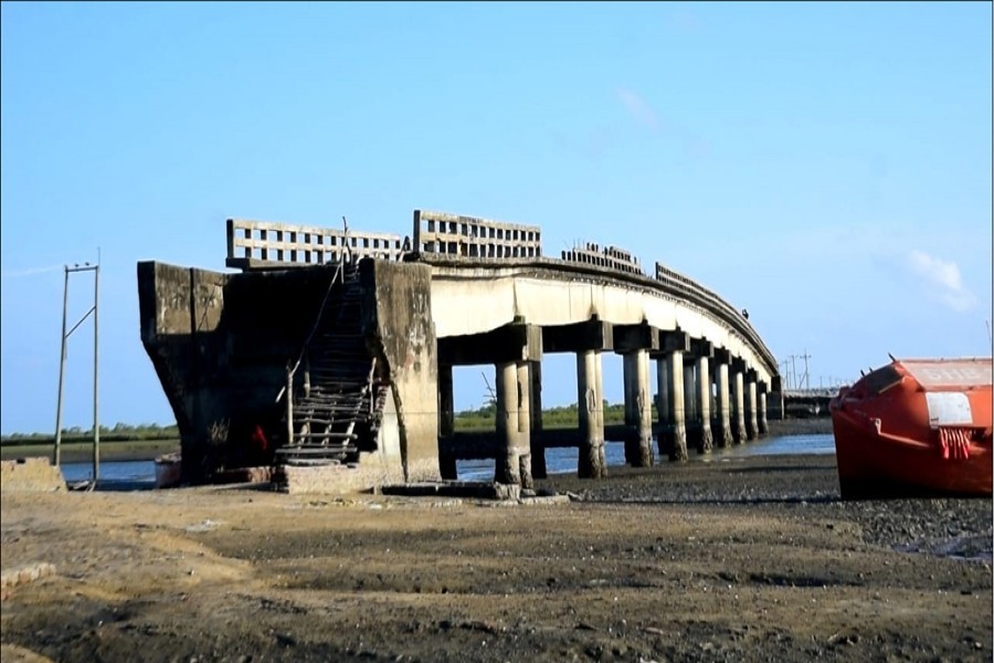 Photo shows a bridge connecting Sonadia Island to Moheskhali upazila of Cox's Bazar has been lying unfit for use for long 12 years as there is no approach road on either side of it — FE Photo