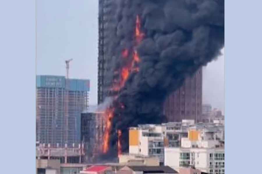 Massive fire engulfs a high-rise building in southern Chinese city