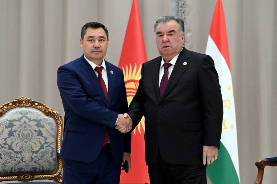 Kyrgyz President Sadyr Japarov shakes hands with Tajik President Emomali Rakhmon during a meeting on the sidelines of the Shanghai Cooperation Organization (SCO) summit in Samarkand, Uzbekistan September 16, 2022. Sultan Dosaliev/Kyrgyz Presidential Press Service/Handout via REUTERS/File Photo