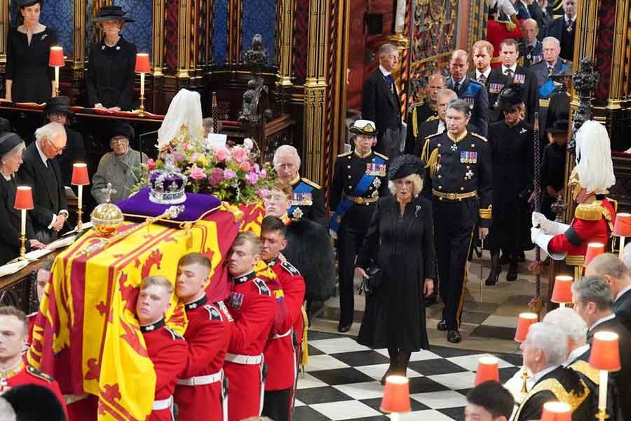 The coffin of Queen Elizabeth II is carried into Westminster Abbey, followed by King Charles III, the Queen Consort, the Princess Royal, Vice Admiral Sir Tim Laurence, the Duke of York, the Earl of Wessex, the Countess of Wessex, the Prince of Wales, the Princess of Wales, Prince George, Princess Charlotte, the Duke of Sussex, the Duchess of Sussex and Peter Phillips, for her State Funeral at the Abbey in London. The photo was taken on Monday.