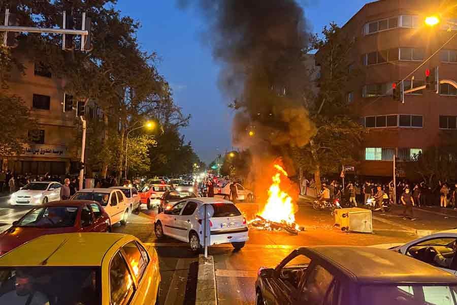 A police motorcycle burning during a protest over the death of a woman in police custody in Tehran, the capital city of Iran, on September 19 this year –Reuters file photo