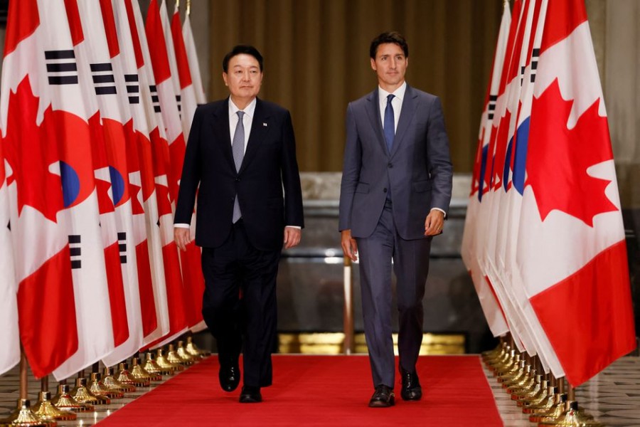 South Korean President Yoon Suk-yeol and Canada's Prime Minister Justin Trudeau arrive to a news conference in Ottawa, Ontario, Canada September 23, 2022. REUTERS/Blair Gable