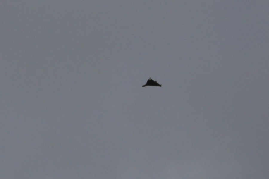 An unmanned aerial vehicle (UAV), what Ukrainian authorities consider to be an Iranian made suicide drone Shahed-136, and uses by Russian forces amid Russia's attack on Ukraine, is seen in a sky over Odesa, Ukraine September 23, 2022. REUTERS/Serhii Smolientsev