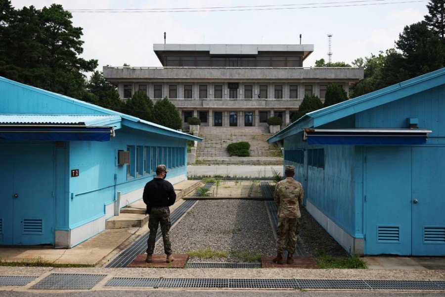 South Korean and US soldiers stand guard in the truce village of Panmunjom inside the demilitarised zone (DMZ) separating the two Koreas, South Korea  on July 19, 2022 — Pool via Reuters/Files