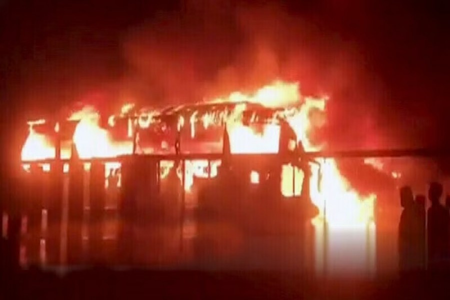 The photo shows a passenger bus on fire in Sindh’s NooriabadCredit: DawnNewsTV