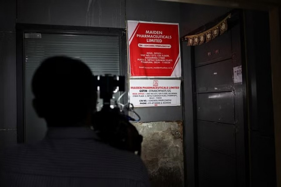 A cameraman takes visuals outside the office of Maiden Pharmaceuticals Ltd company, in New Delhi, India, Oct 6, 2022.REUTERS