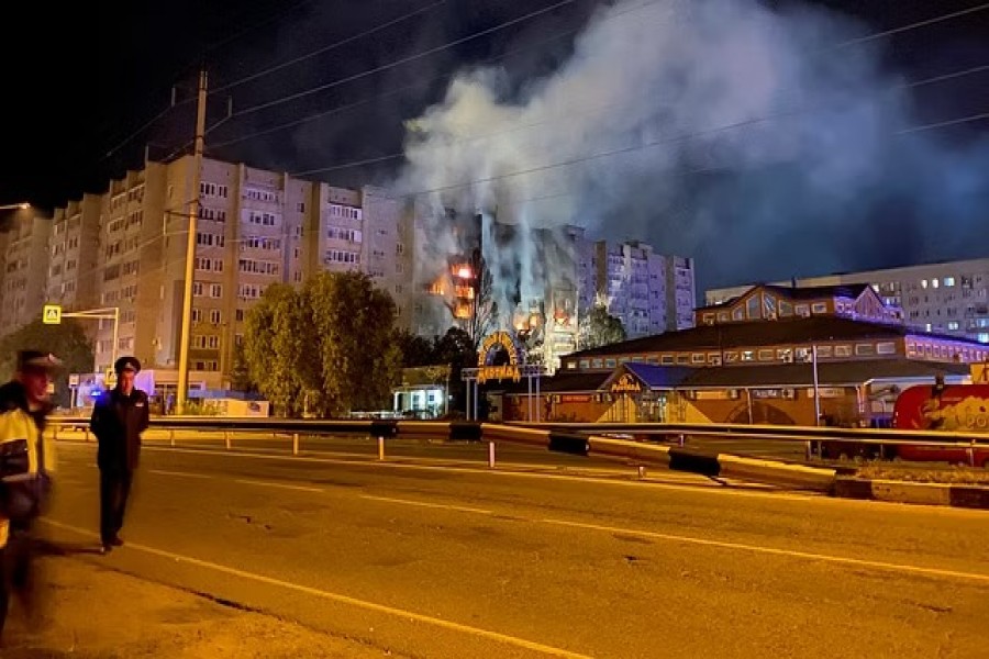 A view shows a site of a plane crash on residential building in the southern city of Yeysk, Russia Oct 17, 2022. REUTERS/Stringer