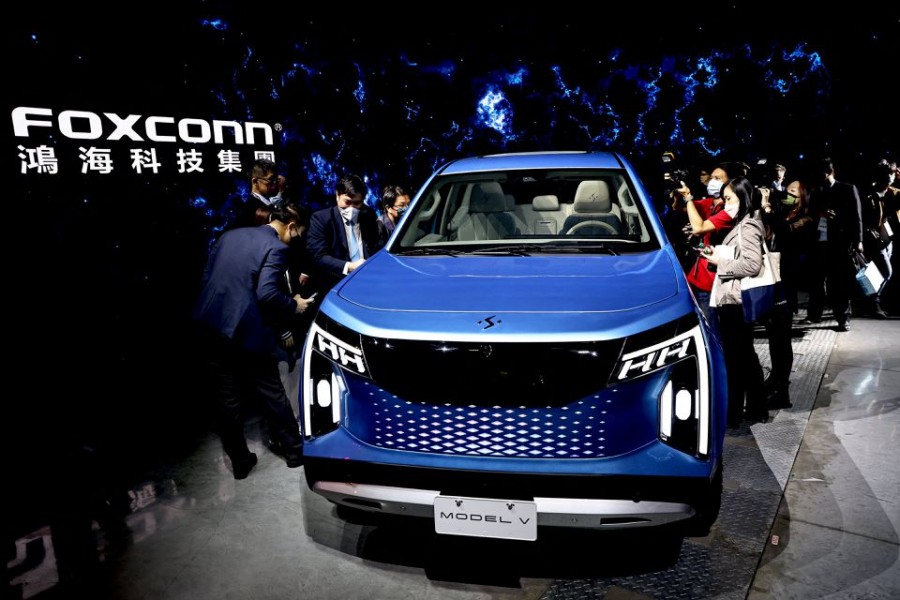 People take photos of Foxconn's new electric pickup vehicle, the Model V, during the company's annual Tech Day in Taipei, Taiwan, October 18, 2022. REUTERS/Ann Wang