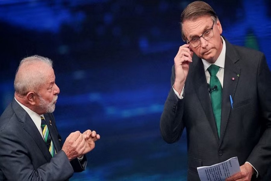 Brazil's former President Luiz Inacio Lula da Silva and Brazil's President Jair Bolsonaro participate in a candidates' debate ahead of a runoff election, in Sao Paulo, Brazil, October 16, 2022. REUTERS/Mariana Greif