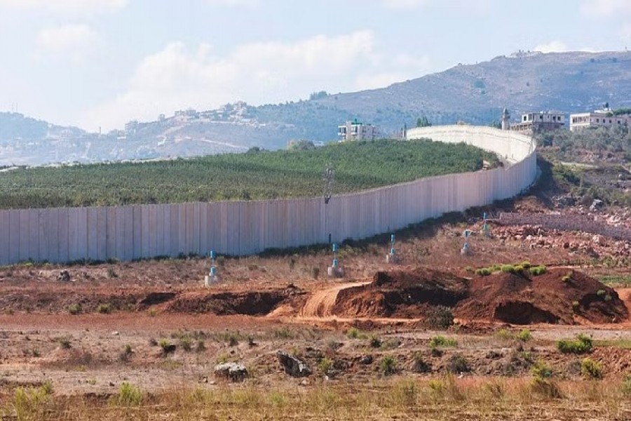 UN "blue line" notifications are pictured near the Lebanese-Israeli border as seen from the southern Lebanese village of Kfar Kila, Lebanon Oct 14, 2022. REUTERS