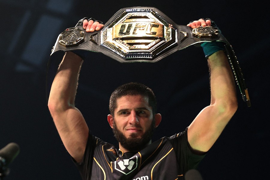 Islam Makhachev celebrates with the belt after winning his fight against Charles Oliveira at UFC 280 at Etihad Arena in Abu Dhabi, United Arab Emirates on October 23, 2022 — Reuters photo