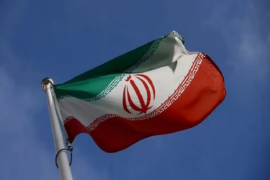 The Iranian flag waves in front of the International Atomic Energy Agency (IAEA) headquarters, before the beginning of a board of governors meeting, in Vienna, Austria, Mar 1, 2021. REUTERS