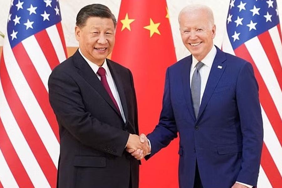 US President Joe Biden shakes hands with Chinese President Xi Jinping as they meet on the sidelines of the G20 leaders' summit