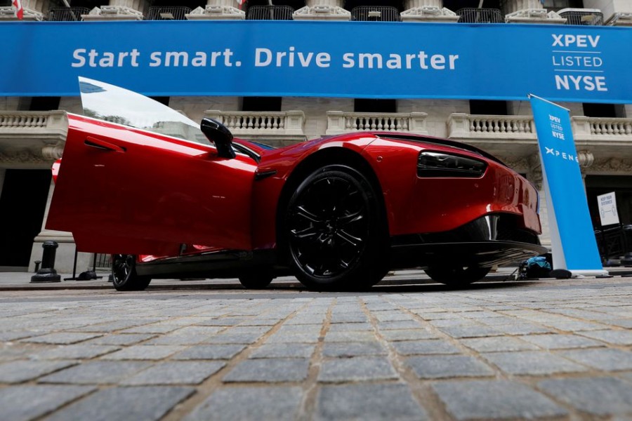 An Xpeng Inc. P7 performance electric car is seen outside the New York Stock Exchange (NYSE) ahead of the Chinese company's IPO trading under the stock symbol "XPEV" in New York, U.S., August 27, 2020. REUTERS/Mike Segar/File Photo