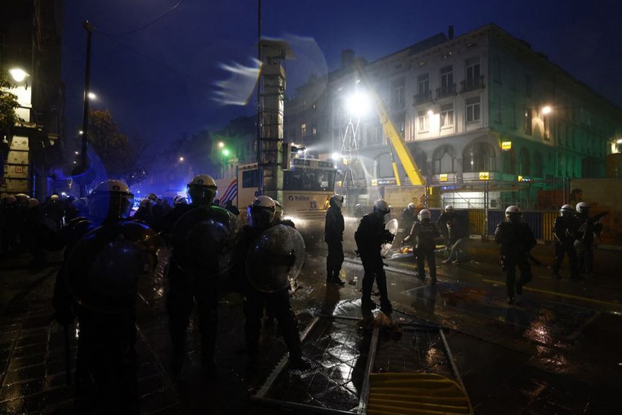 Police officers take positions during clashes in Brussels after the World Cup match between Belgium and Morocco on November 27, 2022  — Reuters photo