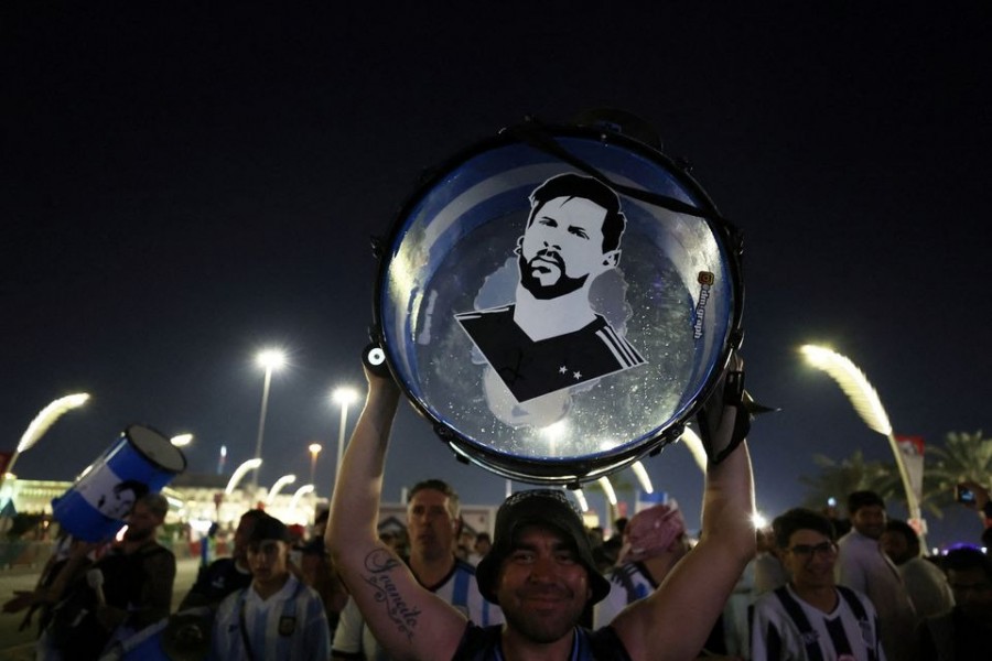 An Argentina fan holds up his drum with an image of Lionel Messi on it on the Doha Corniche in Doha, Qatar on November 25 — Reuters photo