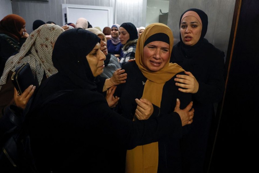 The mother of two Palestinian brothers Dafer and Jawad Remawi mourns at a hospital before their funeral in Ramallah in the Israeli-occupied West Bank on November 29, 2022 — Reuters photo