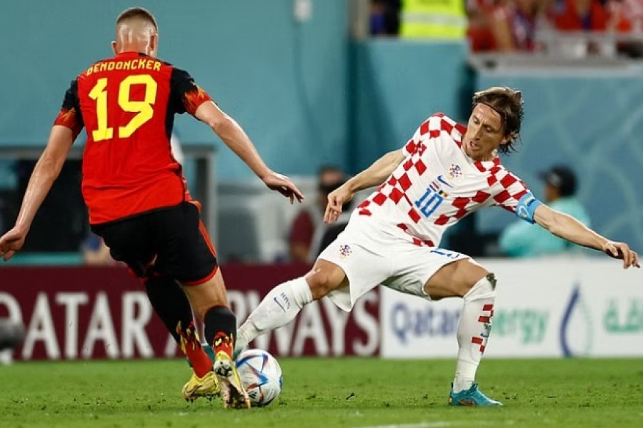 FIFA World Cup Qatar 2022 - Group F - Croatia v Belgium - Ahmad Bin Ali Stadium, Al Rayyan, Qatar - December 1, 2022 Croatia's Luka Modric in action with Belgium's Leander Dendoncker.REUTERS/Stephane Mahe