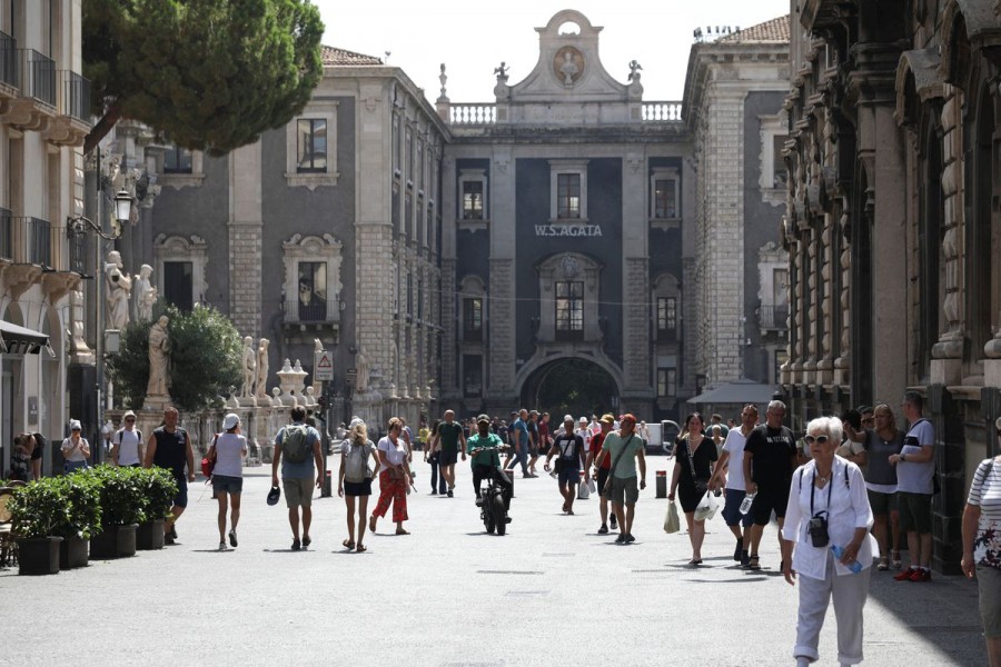 People walk around Piazza del Duomo, in Catania, ahead of Italian general election, in eastern Sicily, Italy, September 8, 2022. REUTERS/Antonio Parrinello