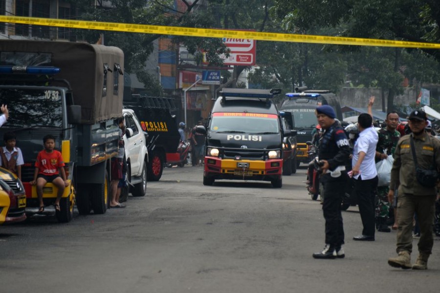 olicemen stand guard at the site of a blast at a police station in Bandung, West Java, Indonesia on December 7, 2022 — Antara Foto via REUTERS