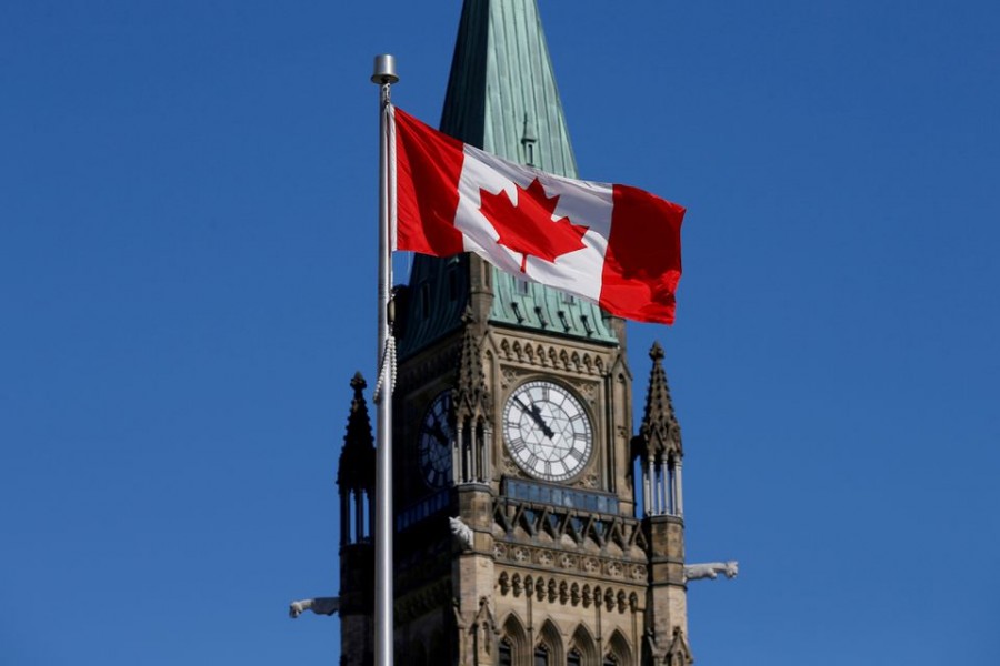 A Canadian flag flies in front of the Peace Tower on Parliament Hill in Ottawa, Ontario, Canada, March 22, 2017. REUTERS/Chris Wattie