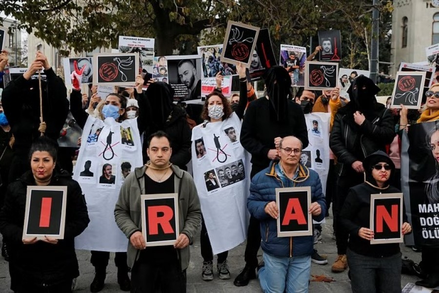 People take part in a protest against the Islamic regime of Iran following the death of Mahsa Amini, in Istanbul, Turkey, Dec 10, 2022.REUTERS