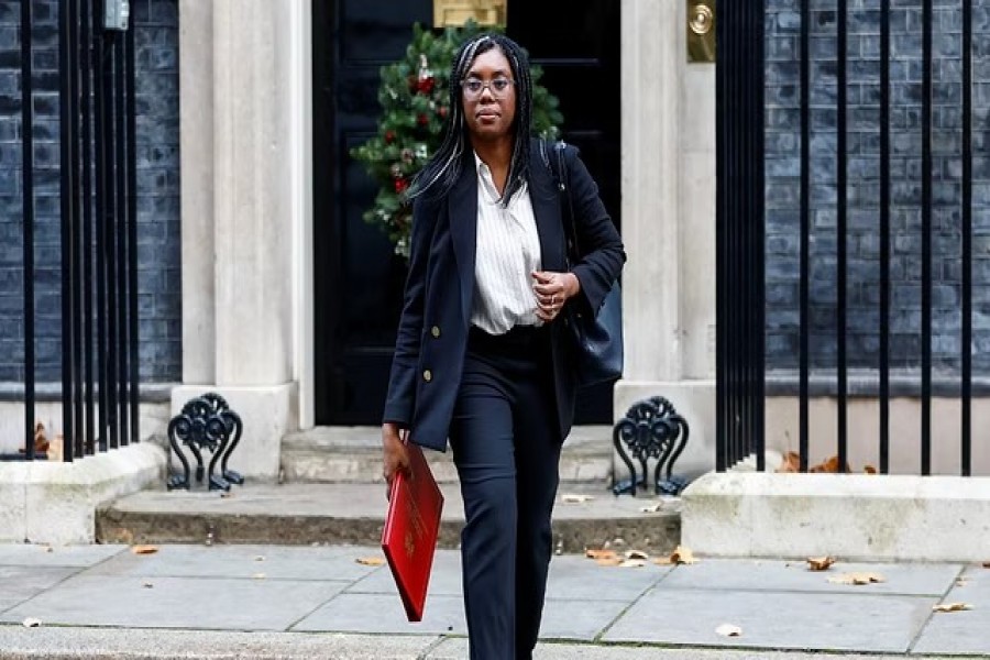 British Secretary of State for International Trade Kemi Badenoch walks outside Downing Street in London, Britain Dec 6, 2022.REUTERS