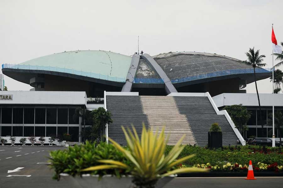 A worker walking on the roof of Indonesian Parliament Building in Jakarta on December 5 this year –Reuters file photo