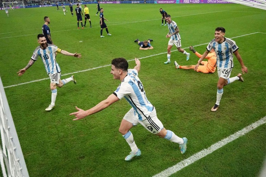 Argentina's Julian Alvarez celebrates scoring their second goal with Lionel Messi, Rodrigo De Paul and Nahuel Molina as Croatia's Dominik Livakovic and teammates look dejected at Lusail Stadium in Lusail, Qatar on December 13, 2022 — Reuters/Files