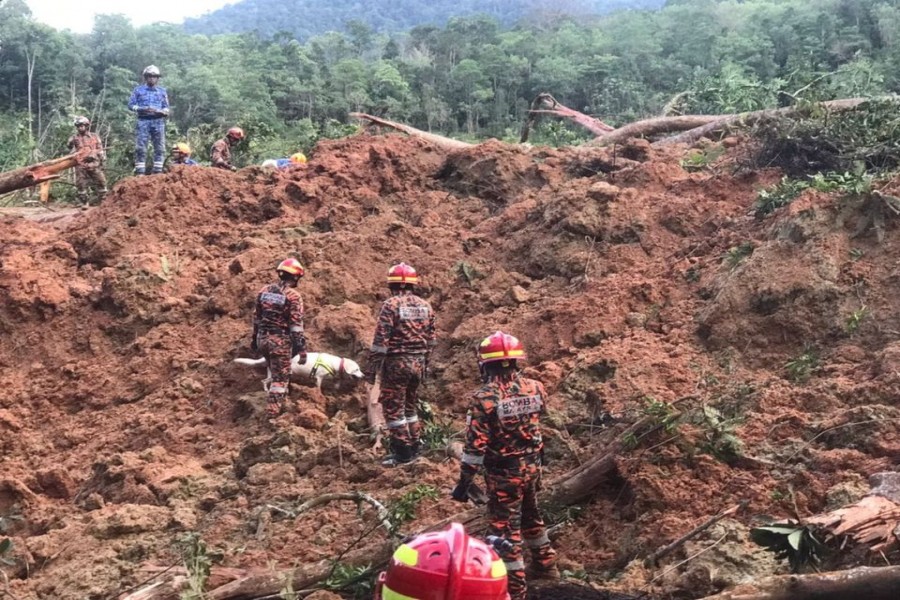 Rescuers work during a rescue and evacuation operation following a landslide at a campsite in Batang Kali, Selangor state, on the outskirts of Kuala Lumpur, Malaysia, December 16, 2022, in this picture obtained from social media. Korporat JBPM/via REUTERS