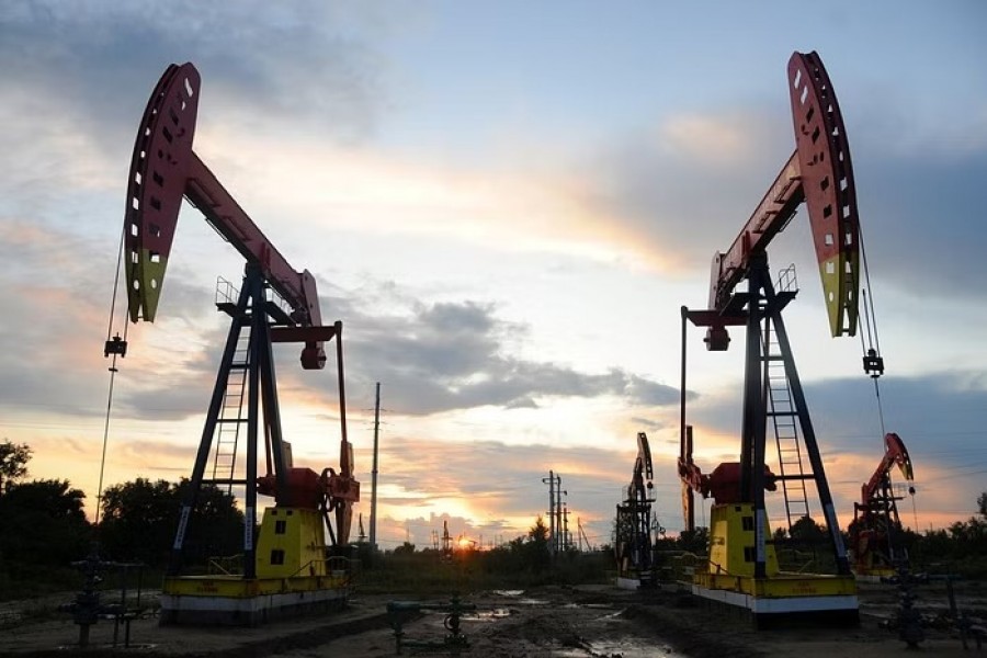 Pumpjacks are seen during sunset at the Daqing oil field in Heilongjiang province, China August 22, 2019. REUTERS