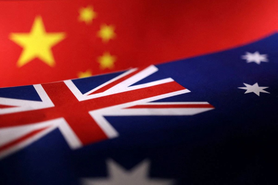 Printed Chinese and Australian flags are seen in this illustration, July 21, 2022. REUTERS/Dado Ruvic/Illustration