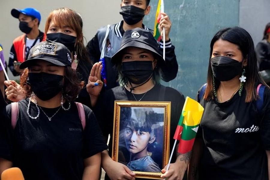 Myanmar citizens who live in Thailand, hold a portrait of former Myanmar state counsellor Aung San Suu Kyi as they protest against the execution of pro-democracy activists, at Myanmar embassy in Bangkok, Thailand July 26, 2022. REUTERS