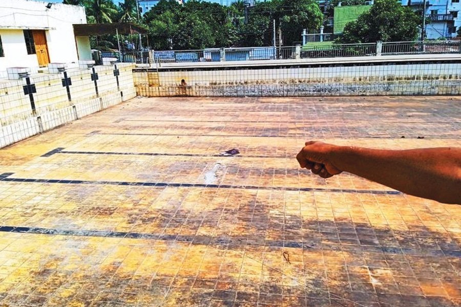 Photo shows the swimming pool in Chandpur Outer Stadium in Chandpur district lying useless for over three years as its water supplying machine went out of order — FE Photo