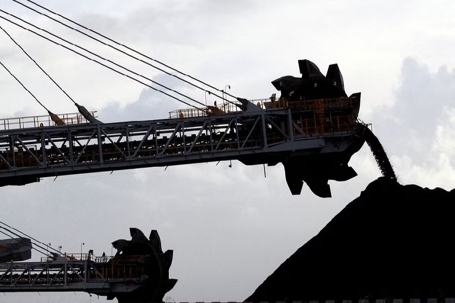 A stacker/reclaimer places coal in stockpiles at the coal port in Newcastle Jun 6, 2012. REUTERS