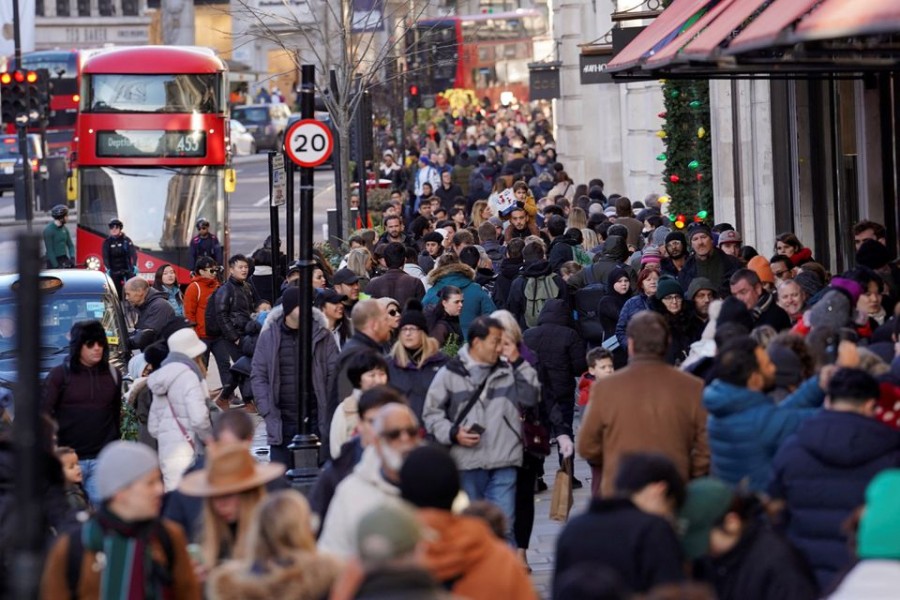 People walk along a busy shopping street, during the traditional Boxing Day sales in London, Britain on December 26, 2022 — Reuters photo