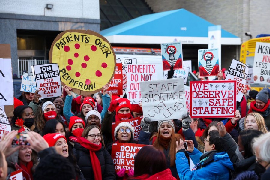 NYSNA nurses hold banners as they walk off the job, to go on strike at Mount Sinai Hospital in New York City, US on January 9, 2023 — Reuters photo