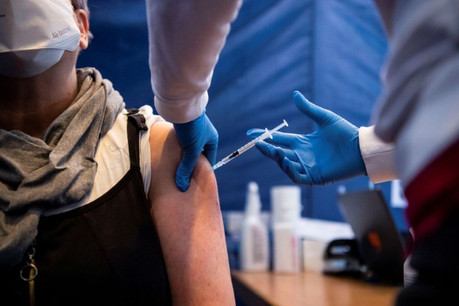 A woman receives the third dose of Covid-19 vaccine, so-called booster, at the vaccination centre in Nuremberg, Germany on November 18, 2021 — Reuters/Files