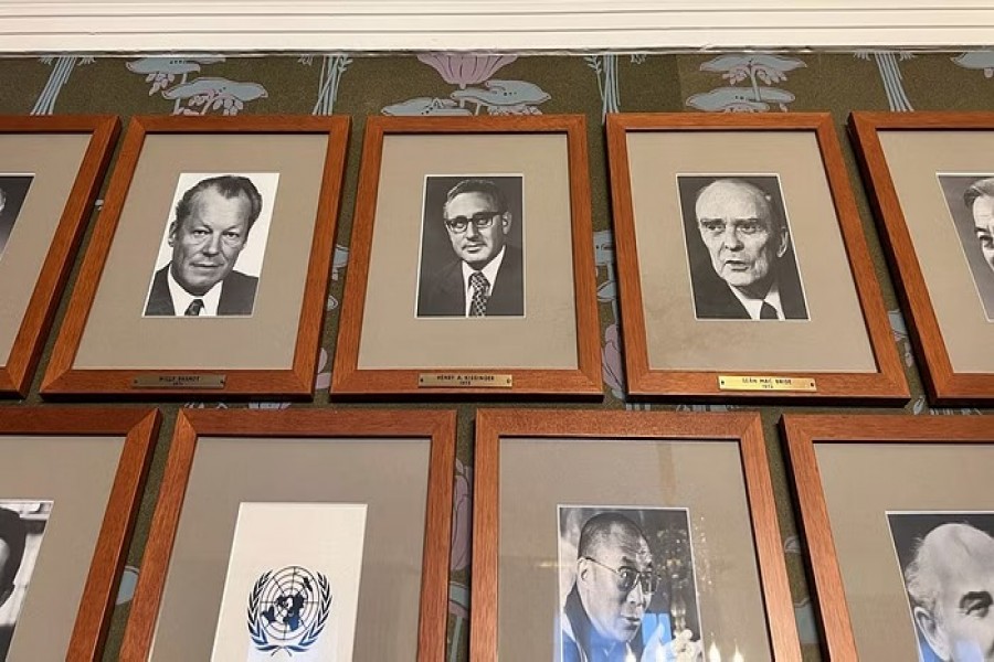 Portraits of Nobel Peace Prize laureates, including of Henry Kissinger, are seen in the meeting room where the Norwegian Nobel Committee holds its meetings at the Norwegian Nobel Institute in Oslo, Norway, January 3, 2023. REUTERS/Gwladys Fouche