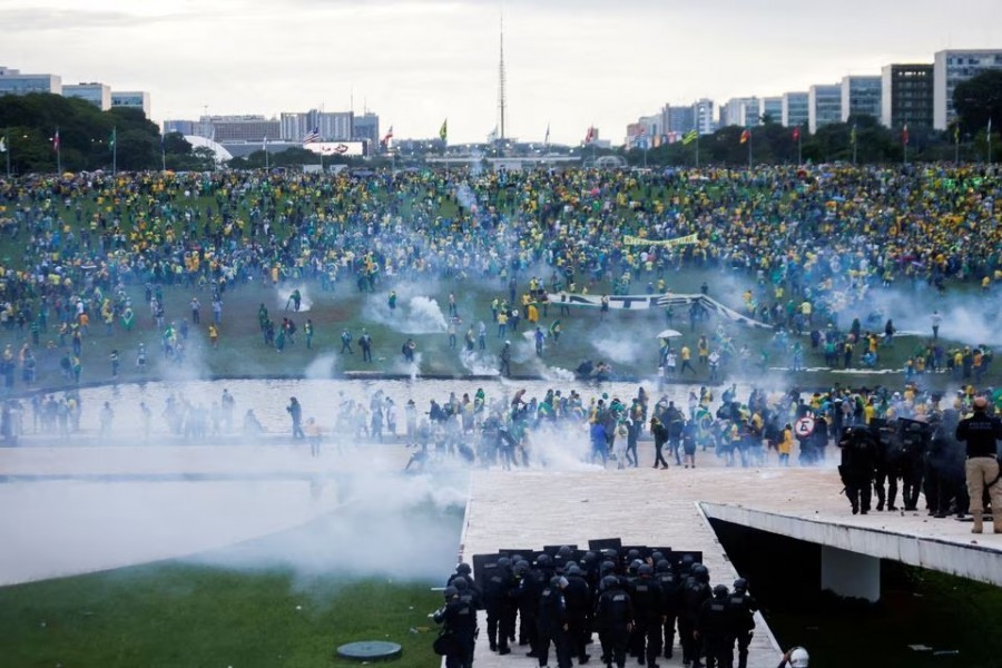 Supporters of Brazil's former President Jair Bolsonaro demonstrate against President Luiz Inacio Lula da Silva as security forces operate, outside Brazil’s National Congress in Brasilia, Brazil on January 8, 2023 — Reuters photo