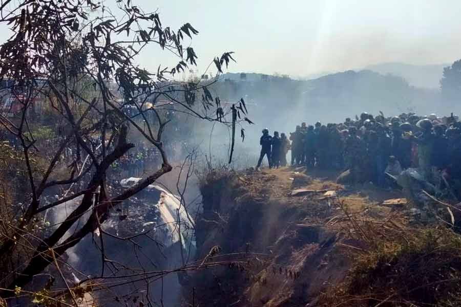 Crowds gathering at the crash site of an aircraft carrying 72 people in Pokhara in western Nepal on Sunday –Reuters photo