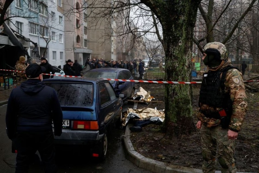 Dead bodies lie on the ground at the site where a helicopter falls on civil infrastructure buildings, amid Russia's attack on Ukraine, in the town of Brovary, outside Kyiv, Ukraine on January 18, 2023