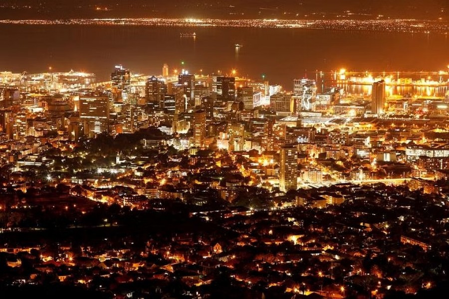 FILE PHOTO: Electricity lights up the central business district of Cape Town, South Africa, Jun 18, 2019. REUTERS