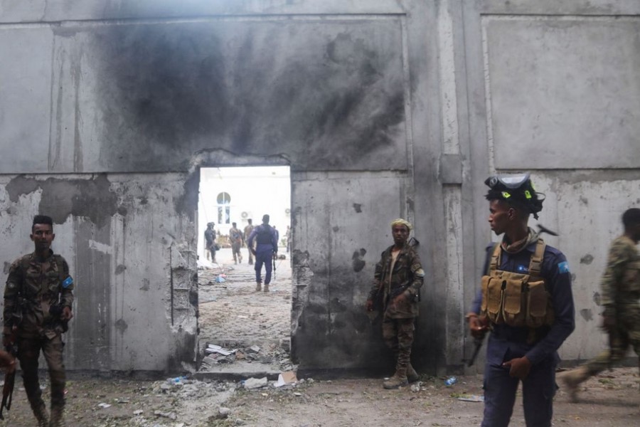 Somali security forces stand outside the mayor's office following a blast in Mogadishu, Somalia January 22, 2023. REUTERS/Feisal Omar