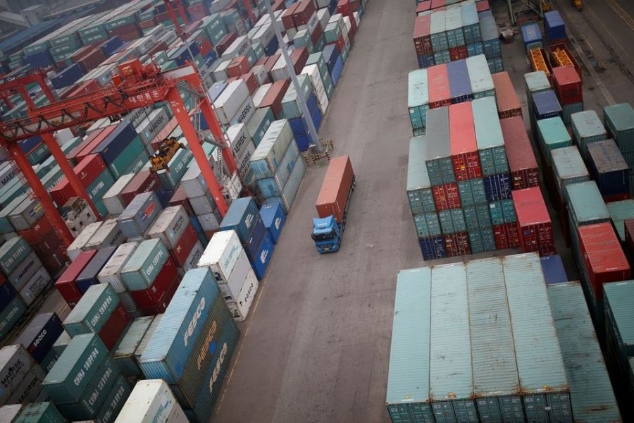 A truck drives between shipping containers at a container terminal at Incheon port in Incheon, South Korea on May 26, 2016 — Reuters/Files