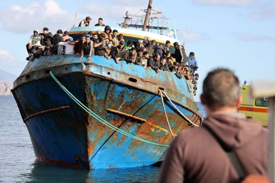 Migrants stand onboard a fishing boat at the port of Paleochora, following a rescue operation off the island of Crete, Greece on November 22, 2022 — Reuters/Files