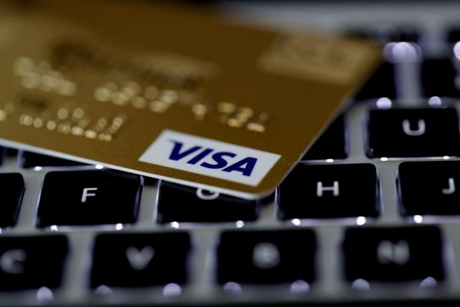 A Visa credit card is seen on a computer keyboard in this picture illustration taken on September 6, 2017 — Reuters/Files