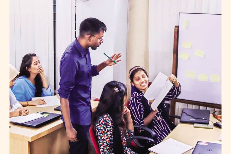 Mohidul Alam, one of the writers of the article, is seen taking an English speaking class