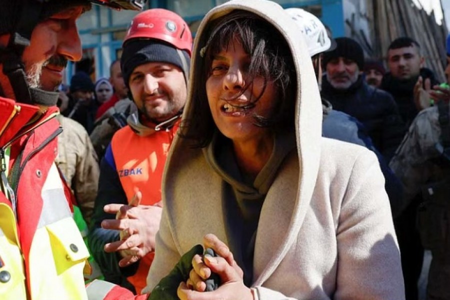 Zubeyde Kahraman, whose sister Zeynep, 40, has been rescued by ISAR Germany, reacts, as the search for survivors continues, in the aftermath of a deadly earthquake in Kirikhan, Turkey Feb 10, 2023. REUTERS